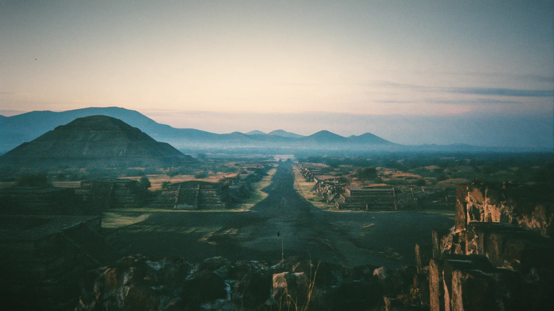 The Avenue of the Dead at Teotihuacan at first light, the Pyramid of the Sun in mist