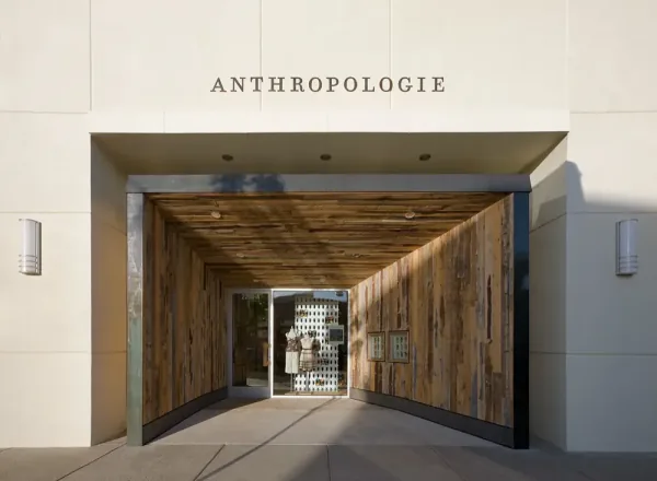 Anthropologie Albuquerque: the entry, a tunnel of sloped reclaimed wood under the name